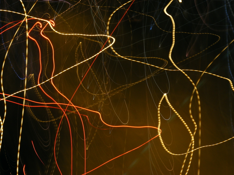 A car, traffic light and street lamp