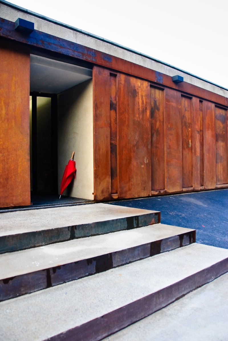 [Less is more]. A red umbrella.