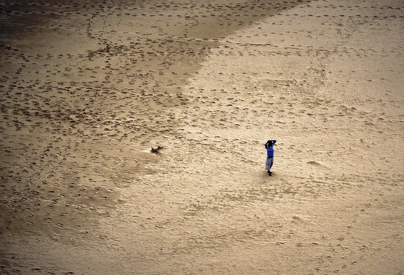 Walking in the beach.