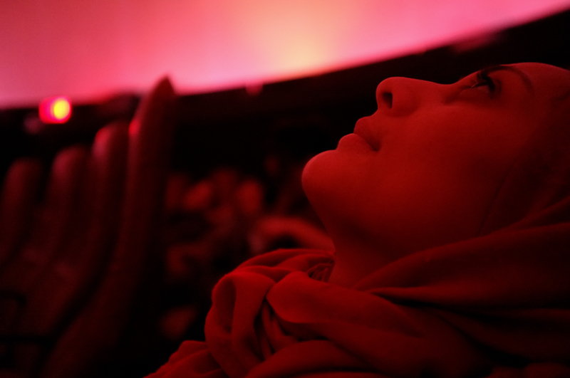Muslim woman looking at the stars