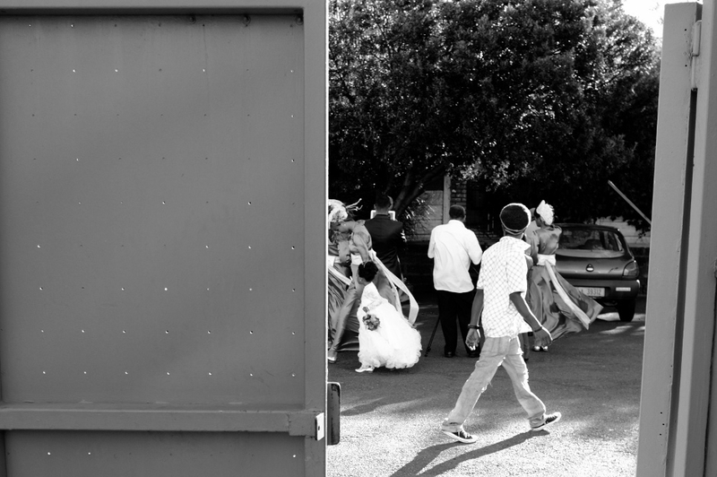 passerby glancing at a bridal party