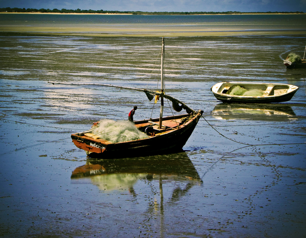 Reflections of a fishing boat